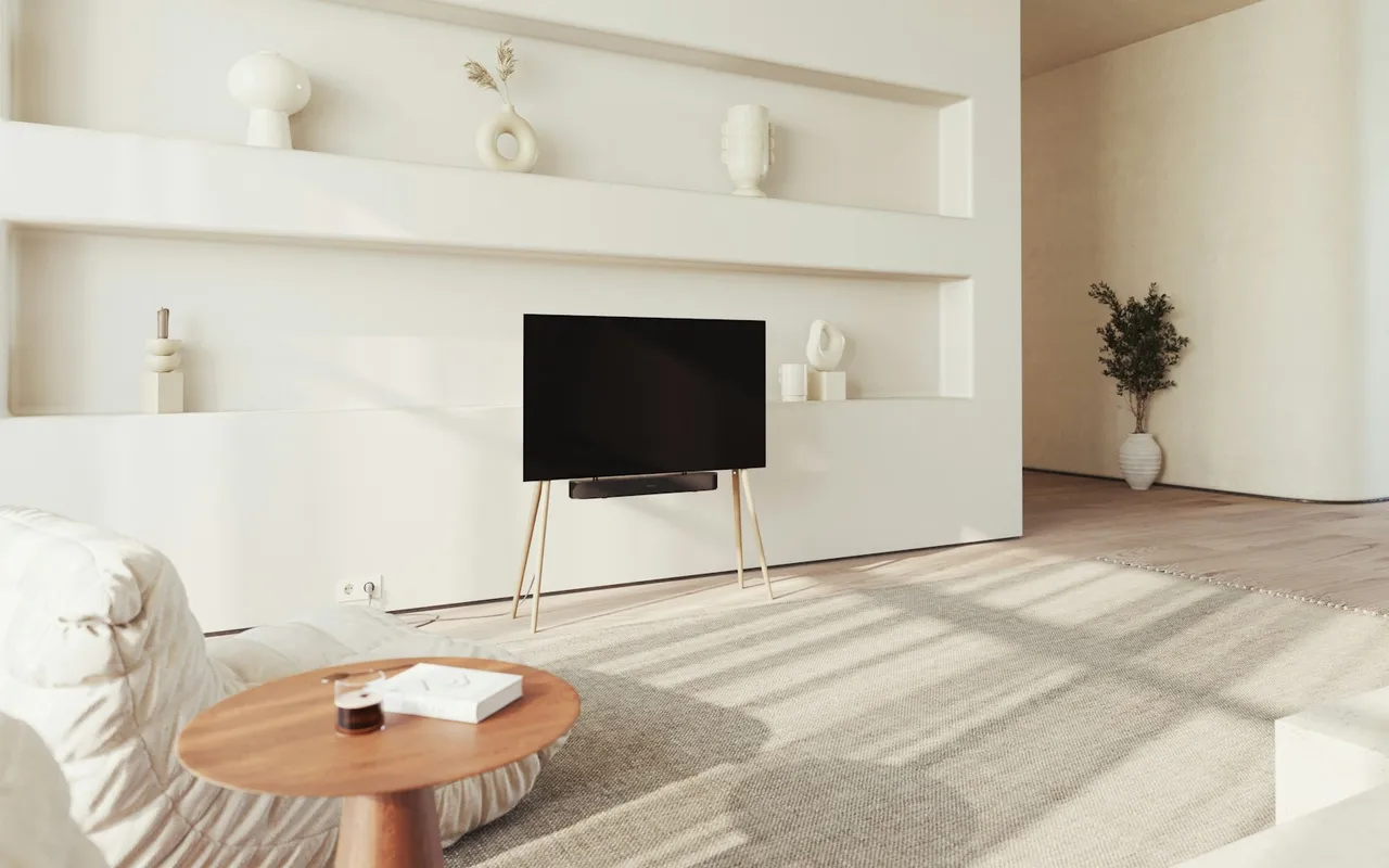A wall-mounted television in a bright living room