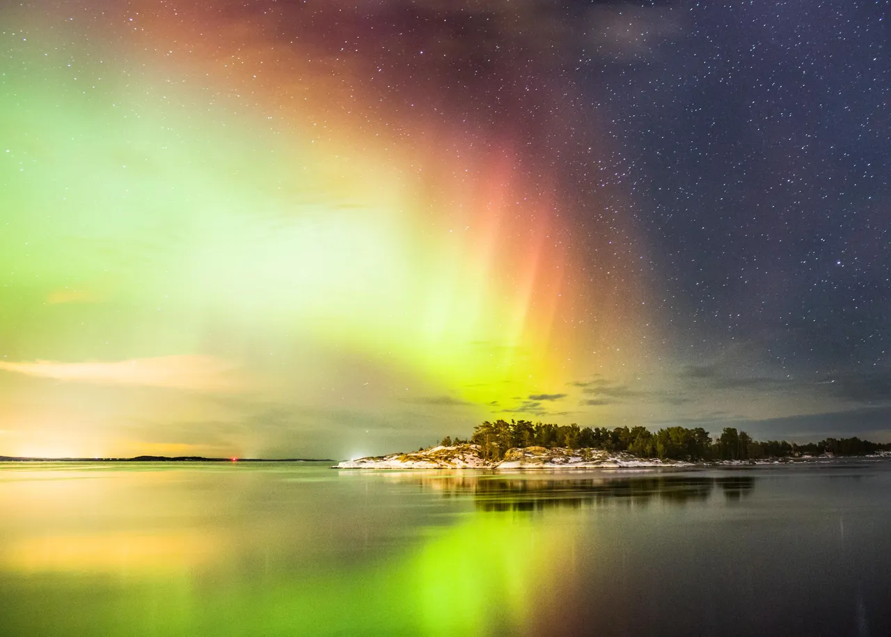 Northern lights over a winter landscape