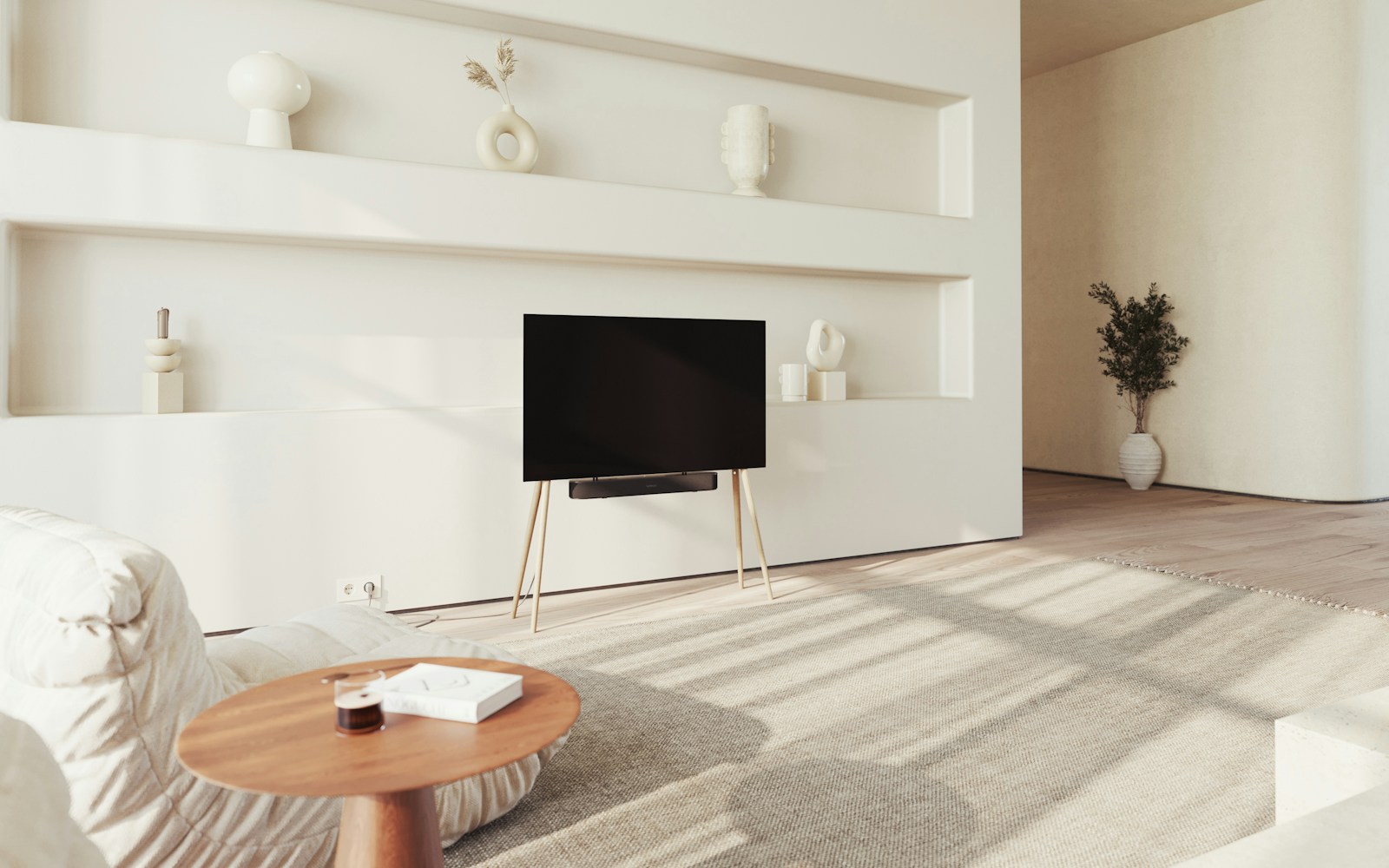 A Scandinavian living room with a flat-screen television and minimalist media unit