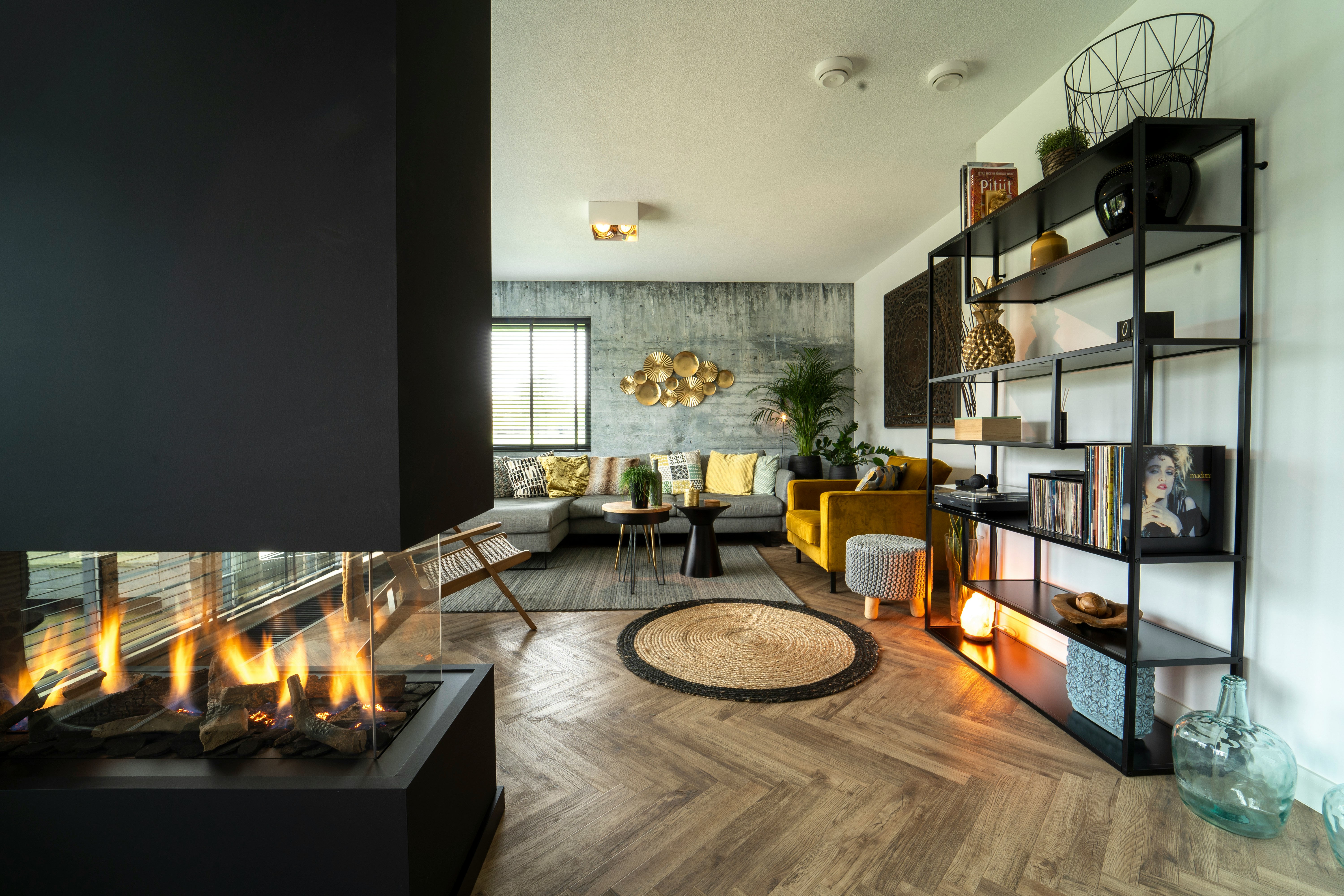 Black fireplace near a flat-screen TV in a modern living room